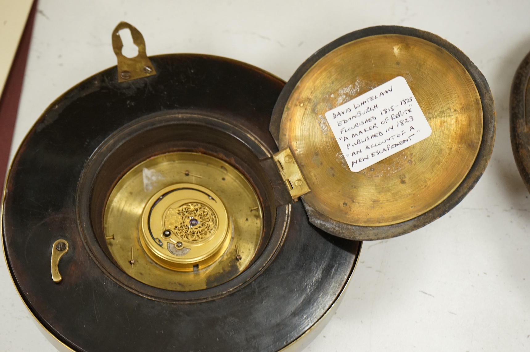 A George III brass-mounted mahogany sedan timepiece, signed David Whitelaw, Edinburgh and numbered 107, 17cm in diameter. Condition - good